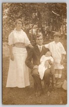 RPPC Edwardian Family Posing for Photo Rustic Outdoor Photo Postcard H23 - £6.39 GBP
