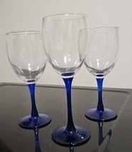 3 Wine Glasses Clear With Cobolt Blue Stems. One Taller Than The Other Two - $10.88