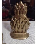 brass detailed pineapple bookends - $662.49 MXN
