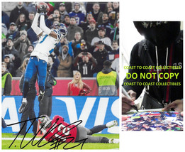 Tariq Woolen signed Seattle Seahawks football 8x10 photo proof COA.autographed. - £94.73 GBP