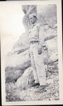 Vintage Soldier Standing On Rocky Area Snapshot WWII 1940s - £3.97 GBP