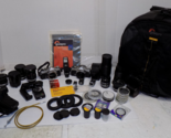 2 Olympus OM 1 35mm SLR Film Cameras with Lenses Filters Backpack and More - $1,371.98