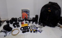 2 Olympus OM 1 35mm SLR Film Cameras with Lenses Filters Backpack and More - $1,371.98