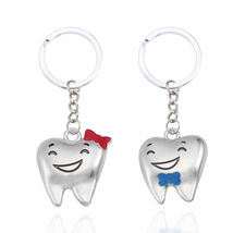 alloy creative lover smile face teeth pair keychain - $14.00
