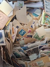 100 Gram World Stamps On Paper - $1.50