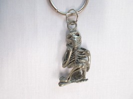 NEW 3D HUMAN SKELETON SMILING HAND UNDER HEAD DETAILED PEWTER KEY RING K... - $9.99