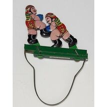 Tin Litho Sumo Wrestlers Hand Squeeze Reversible Toy - $14.25