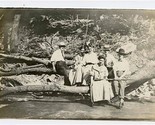 Men &amp; Women on Log Over Stream with Man Holding Rifle Real Photo Postcard - $37.62