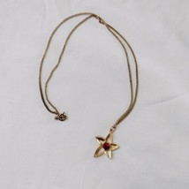 Vintage Gold Tone Red Rhinestone Star Flower Pendant Necklace Openworked 24&quot; - £14.37 GBP
