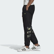 NWT men&#39;s large Adidas Originals Woven football Pants FM3401 black/aztec... - $47.49