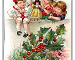A Bright Christmas Children Playing With Doll Holly Embossed DB Postcard... - $5.89