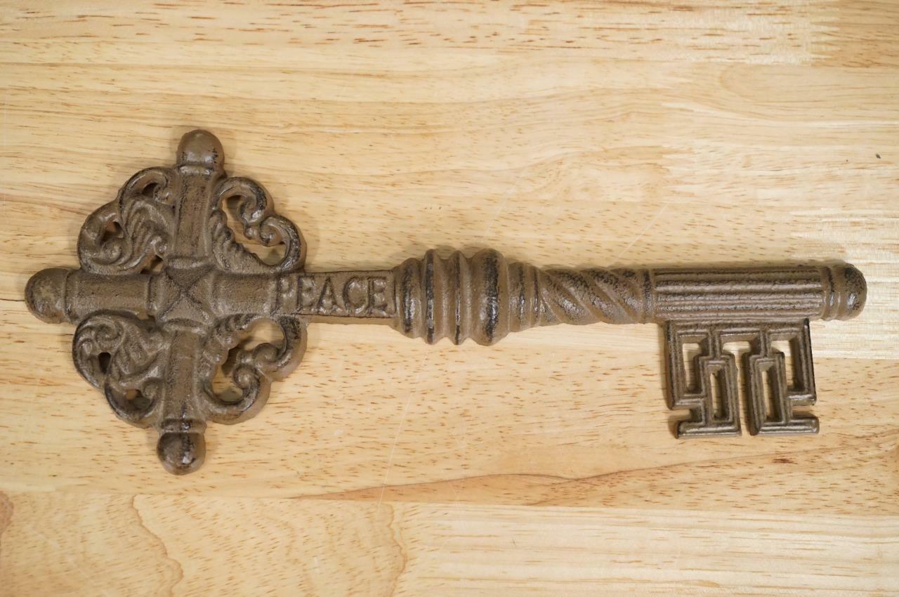 Vintage Primitive Wall Art Cast Iron Brown Metal PEACE Skeleton Key 11.5... - $24.64