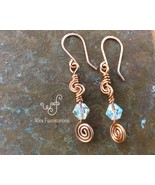 Handmade copper earrings: knot coils, spirals, and clear bicone crystals - €17,11 EUR