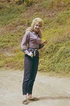 Donna Douglas in The Beverly Hillbillies standing in road with flower 18x24 Post - $23.99
