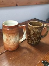 Vintage Lot of 2 Brown Feather &amp; Orange &amp; Cream with Two Men Pottery Mug... - £9.76 GBP