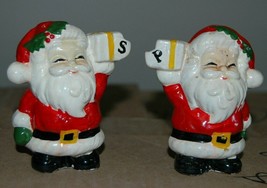 Vintage Santa Claus Holding Present Salt &amp; Pepper Set Christmas Festive ... - $19.99