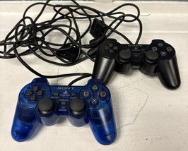 Pair Of Sony PlayStation 2 PS2 Dual Shock Analog Controllers Crystal Blue Black - $49.49