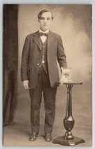 RPPC Gentleman Posing With Framed Portrait On Table Studio Photo Postcard R30 - $13.95