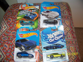 lot of {4} diecast cars   mint  i.o.p {hotwheels} - £9.46 GBP