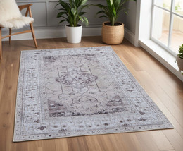 4&#39; X 6&#39; Gray Tan and Ivory Oriental Power Loom Worn Faded Washable Area Rug - $45.49+