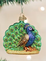 Old World Christmas glass Ornament 16074 peacock bird 3.5” - $250.01 MXN