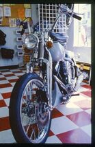 35 mm color slide * 1987 INSIDE VIEW of MOTORCYCLE SHOP Bike parts signs - $5.45