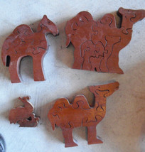Cool lot of 4 Thick Wood Camel Figural Puzzle Figurines - $510.47 MXN
