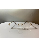 Unisex, rimless, oval shaped eyeglasses with clear lenses and gold frame - $10.00