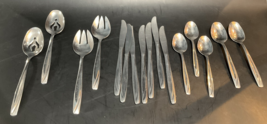 Casual International Silver Stainless Flatware Set of 16 Glossy Swirled ... - £22.33 GBP