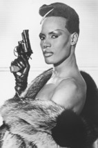 Grace Jones cool pose with gun and fur coat 18x24 Poster - $23.99