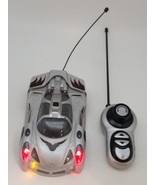 Remote Control Car Lights Up and Spins Silver *TESTED AND WORKING* - $20.90