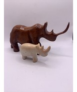 2 Rhinoceros- 1 Hand Carved Wooden Figure And 1 African Soapstone Folk Art. - $23.75