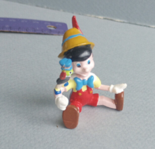 Applause Pinocchio Sitting Jiminy Cricket on Arm  Figure 2.5" - $12.19