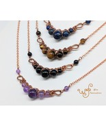 Handmade copper necklace: criss cross copper wire wrapped round stones - €28,24 EUR+