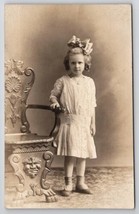 RPPC Pretty Little Girl Big Bow Ornate Chair Studio Photo Postcard F23 - £8.00 GBP