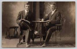 RPPC Two Handsome Men Book Table Little Falls MN To Borrby Sweden Postcard B32 - £12.49 GBP