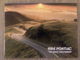 1984 Pontiac We Build Excitement Sales Brochure with Model/Engine Combin... - £7.96 GBP