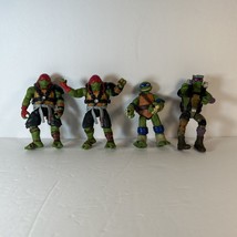 lot of 4 Teenage Mutant Ninja Turtles, 2 Raphiel, 1 Dona and 1 Leonardo - $14.52