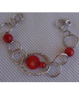 Rounds silver bracelet with coral colored - $534.08 MXN