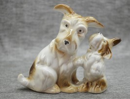 Vintage porcelain figurine of a dog with a puppy - $10.50
