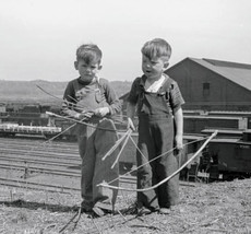 Vintage Photo Reproduction Boys playing with bows and arrows near railroad yards - $4.93+