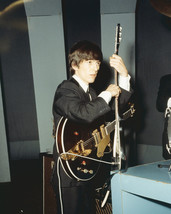 The Beatles George Harrison tuning guitar before performance 1965 16x20 Poster - £15.73 GBP
