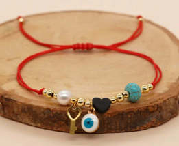 Jet red thread protection bracelet / Pulsera de protección hilo rojo aza... - $224.94 MXN