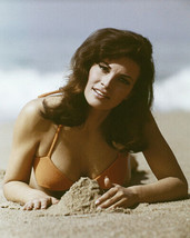 Raquel Welch in orange bikini lies on beach building sand castle 8x10 inch photo - £9.43 GBP