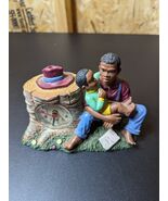 African father and son with clock figurine - €24,52 EUR