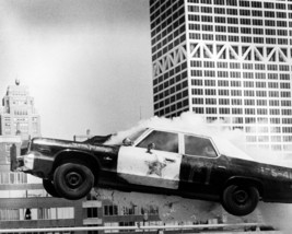 The Blues Brothers Police car in Flight with Smoke Coming from it 16x20 Canvas - $69.99