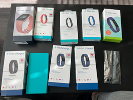 Lot of 9 Fitbits FOR PARTS ONLY VERSA ALTA FLEX 2 CHARGE 2 with bands - £34.99 GBP