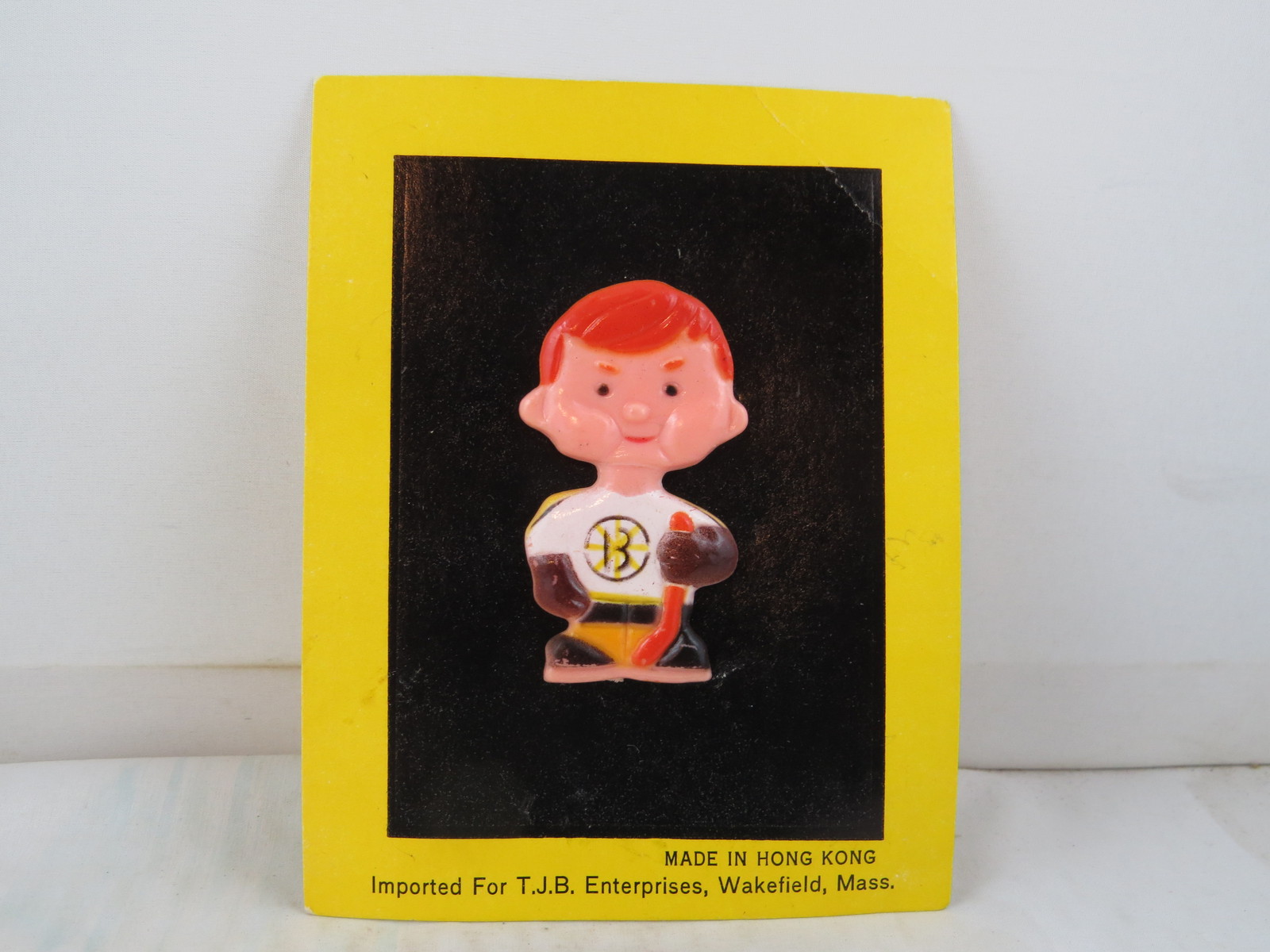 Primary image for Boston Bruins Pin (VTG) - Boy in Home in Uniform  Celluloid Pin - New on Card