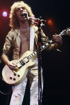 Peter Frampton plays guitar in concert 1970&#39;s in gold jacket 24x18 Poster - £19.15 GBP