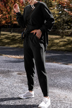 Black Solid Color High Low Pullover and Skinny Pants Set - $796.28 MXN